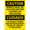 Bilingual Vinyl Sign - Caution Wheels Must Be Chocked Before Loading Unloading