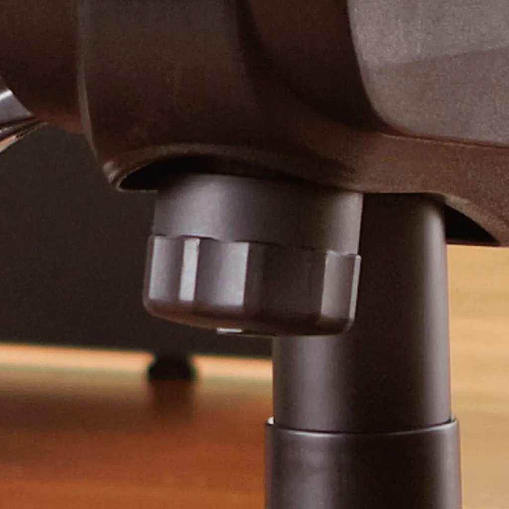 A close-up of the base of an office chair, showing the pole and wheel.