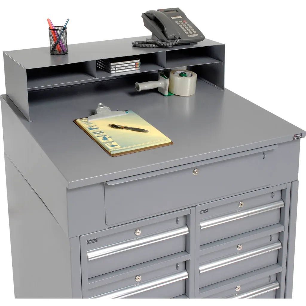 Gray metal storage cabinet with top drawer open and office supplies