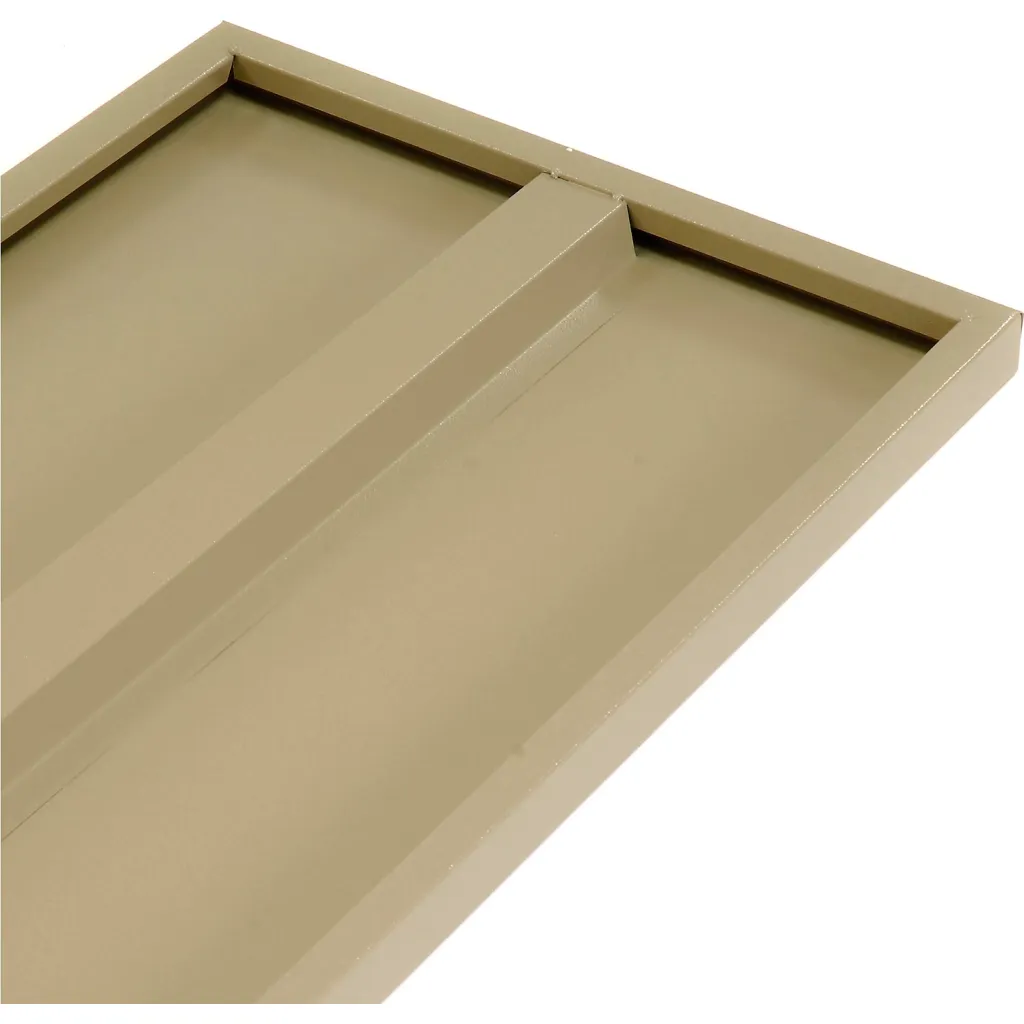 A close-up of a beige drawer organizer tray's corner and divider.