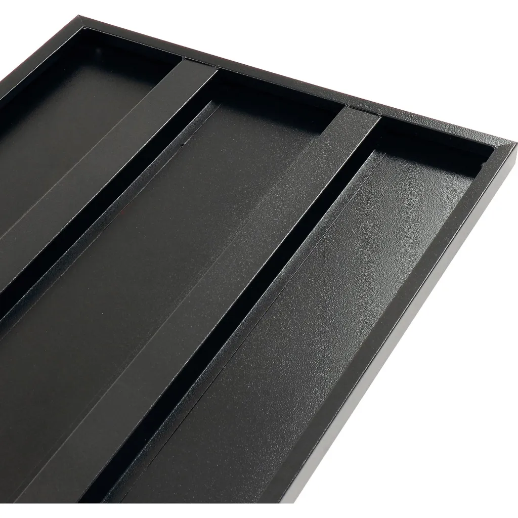 A close-up of a black tray with three compartments.