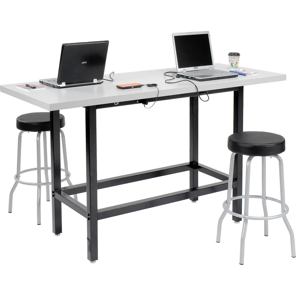 Standing desk with two laptops and stools