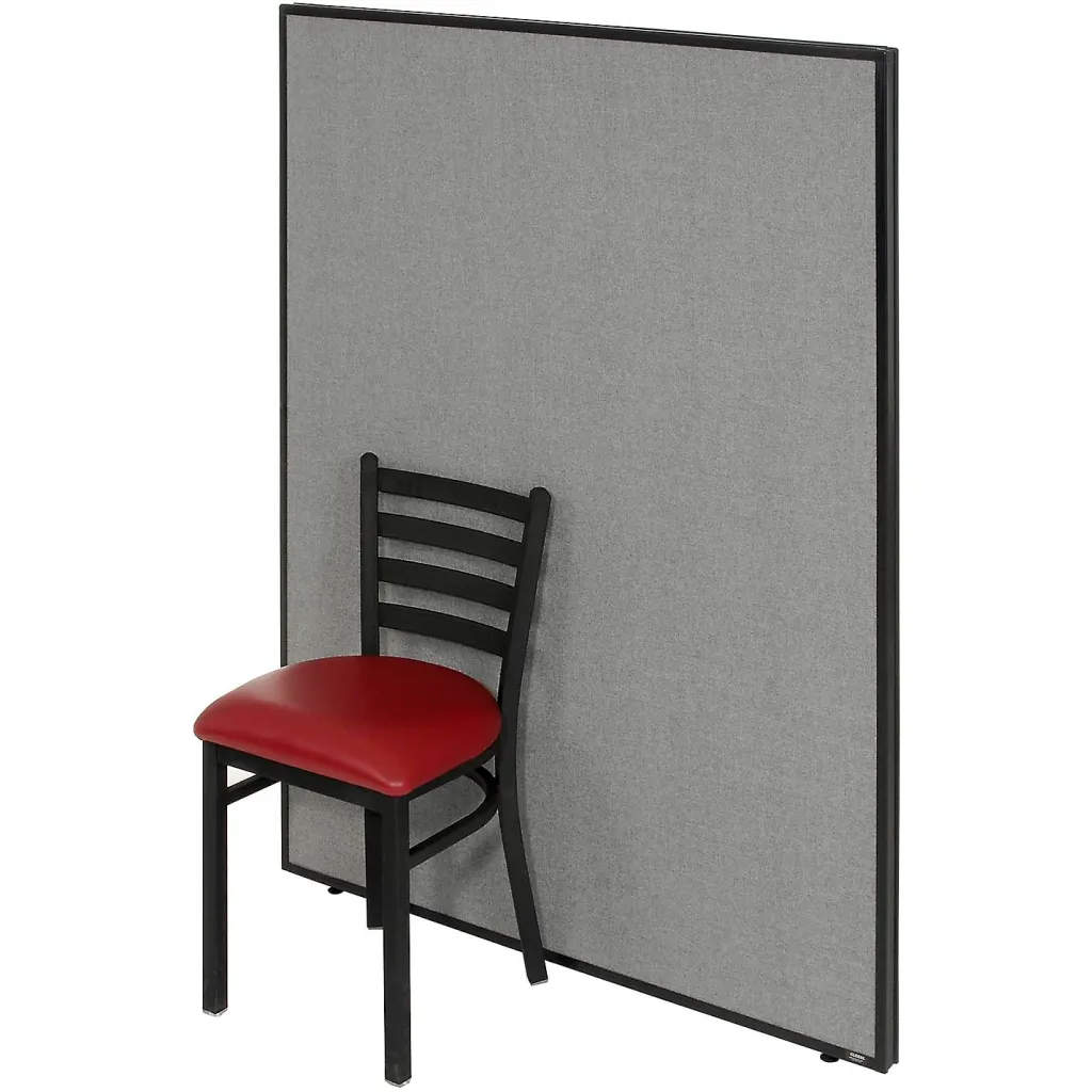 Gray fabric-covered partition panel with black metal frame and red chair