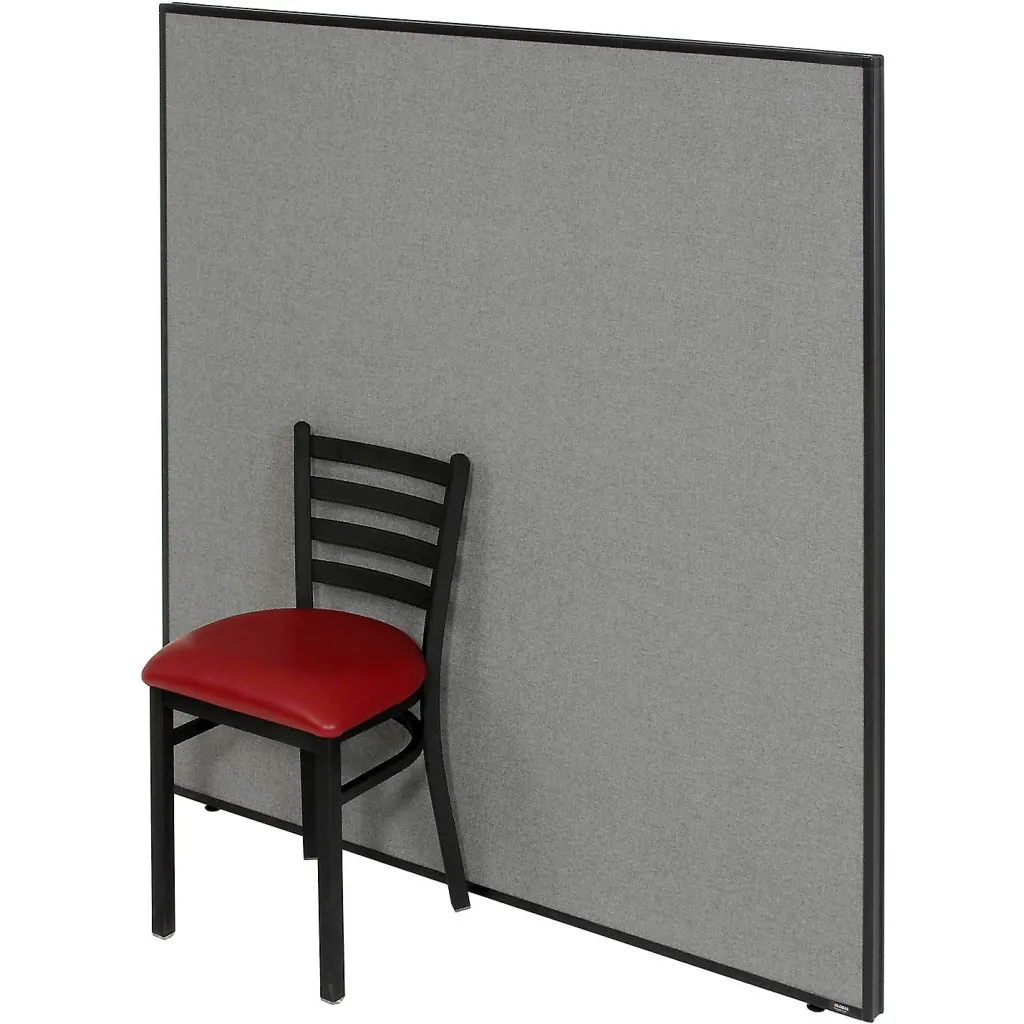 Gray fabric-covered partition panel with black metal frame and red chair