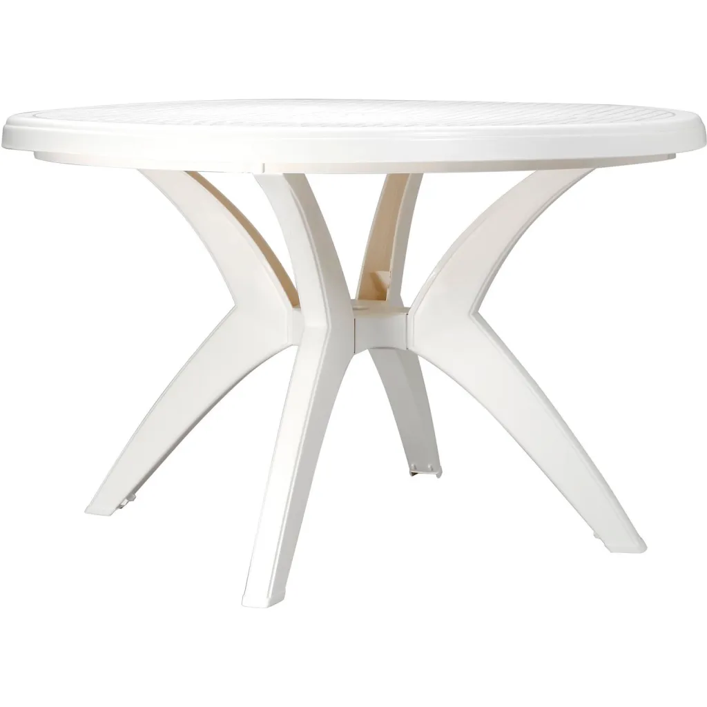 A white round table with four legs from a different angle