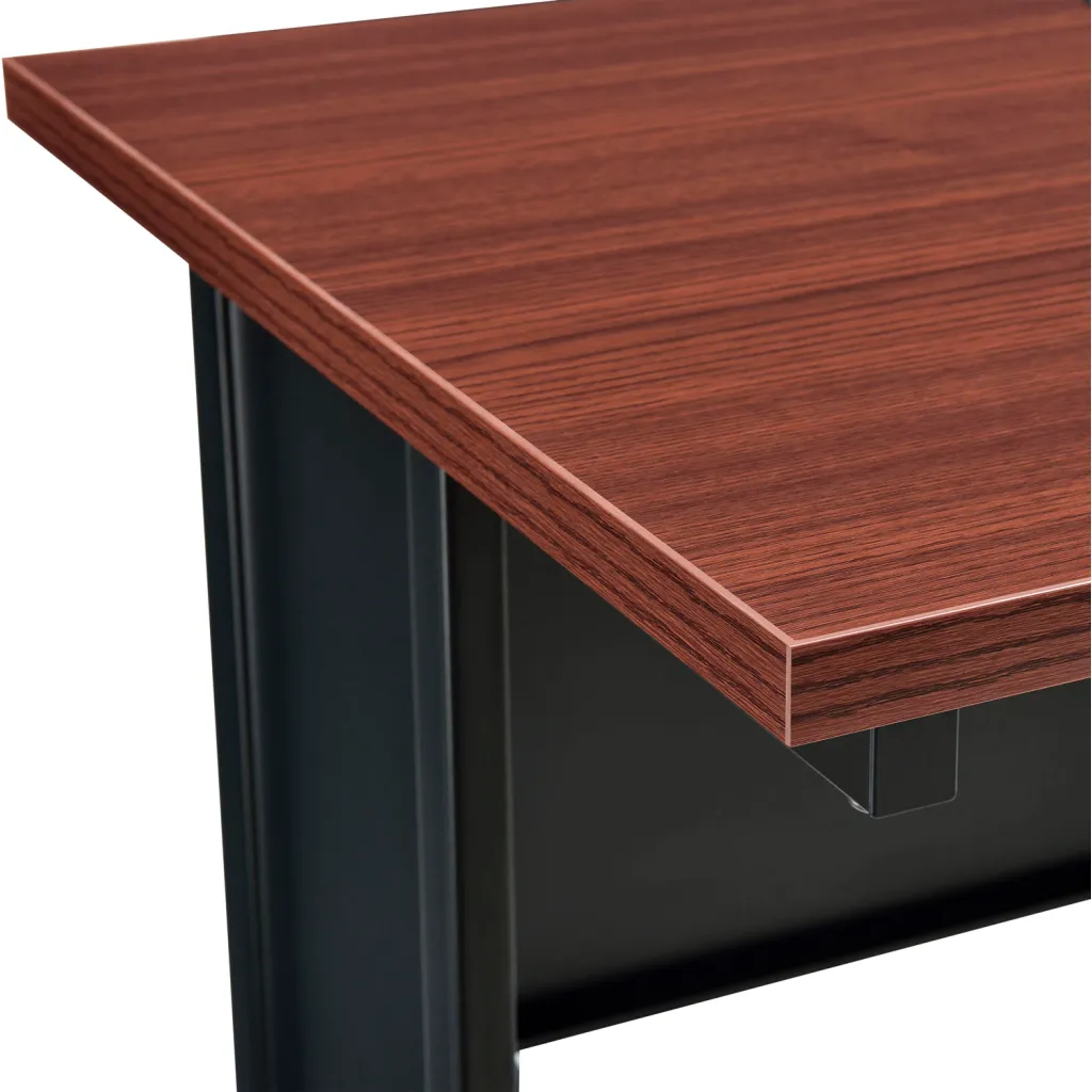Close-up of standing desk corner with brown wood grain top and black metal leg
