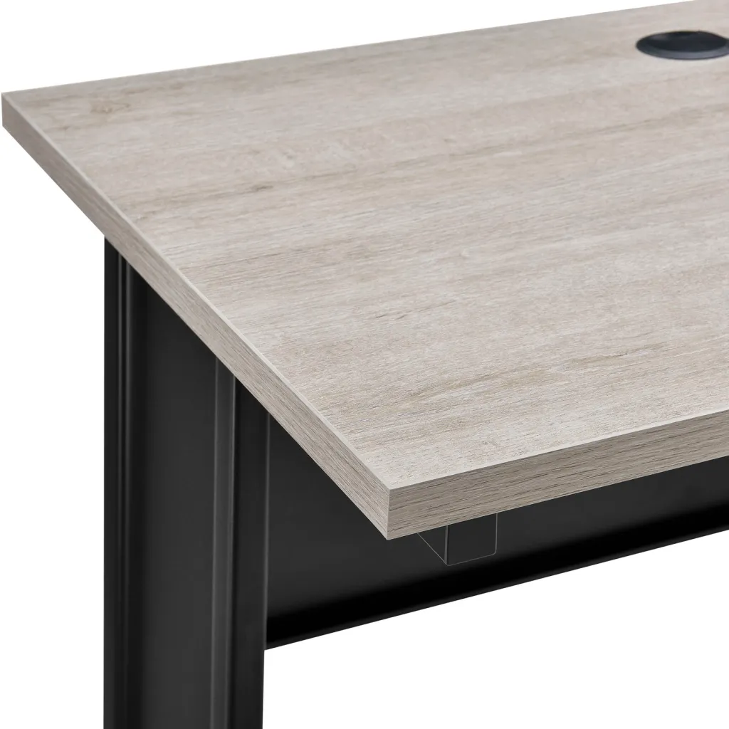 Close-up of standing desk corner with light gray wood top