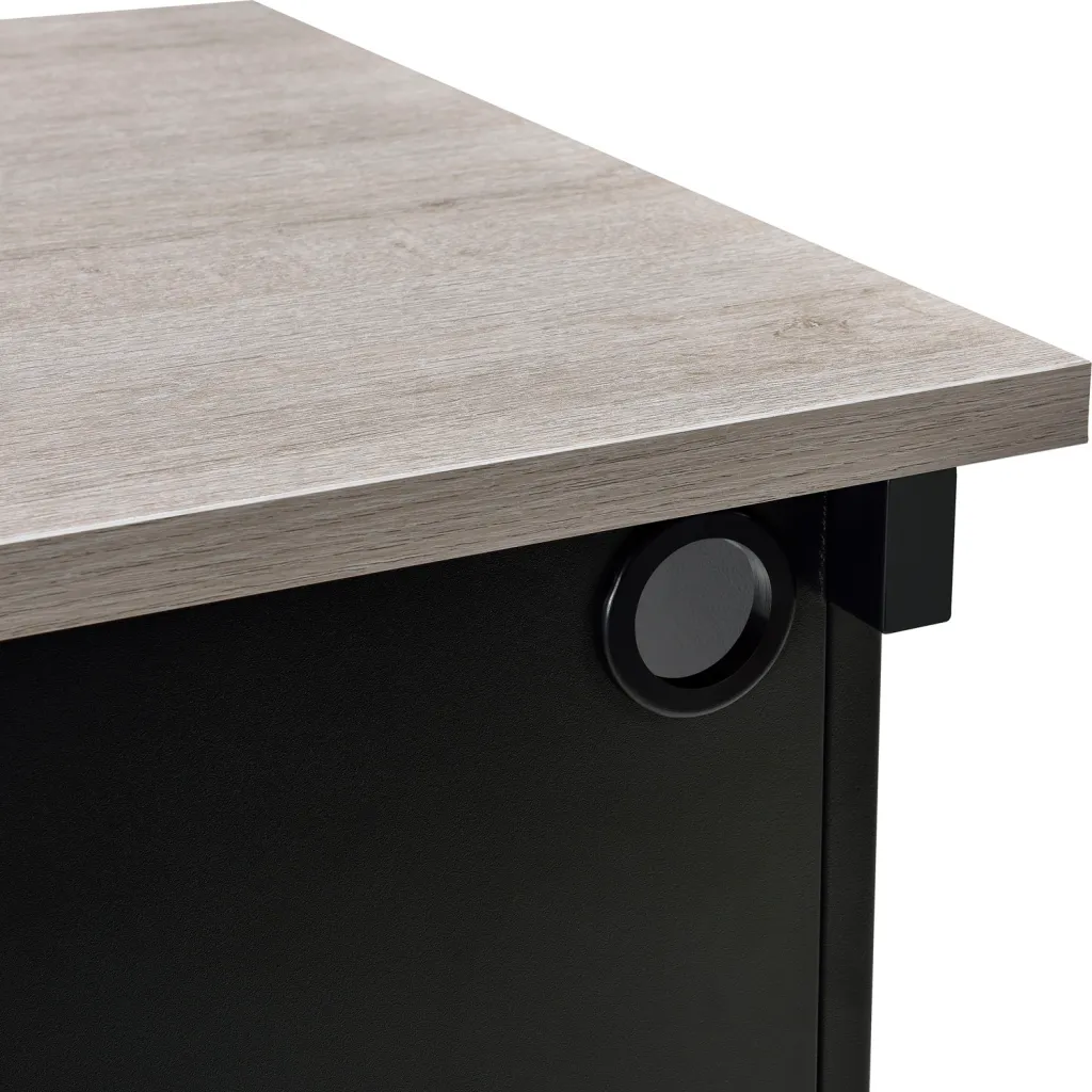 Close-up of standing desk corner with light gray wood top and cable management