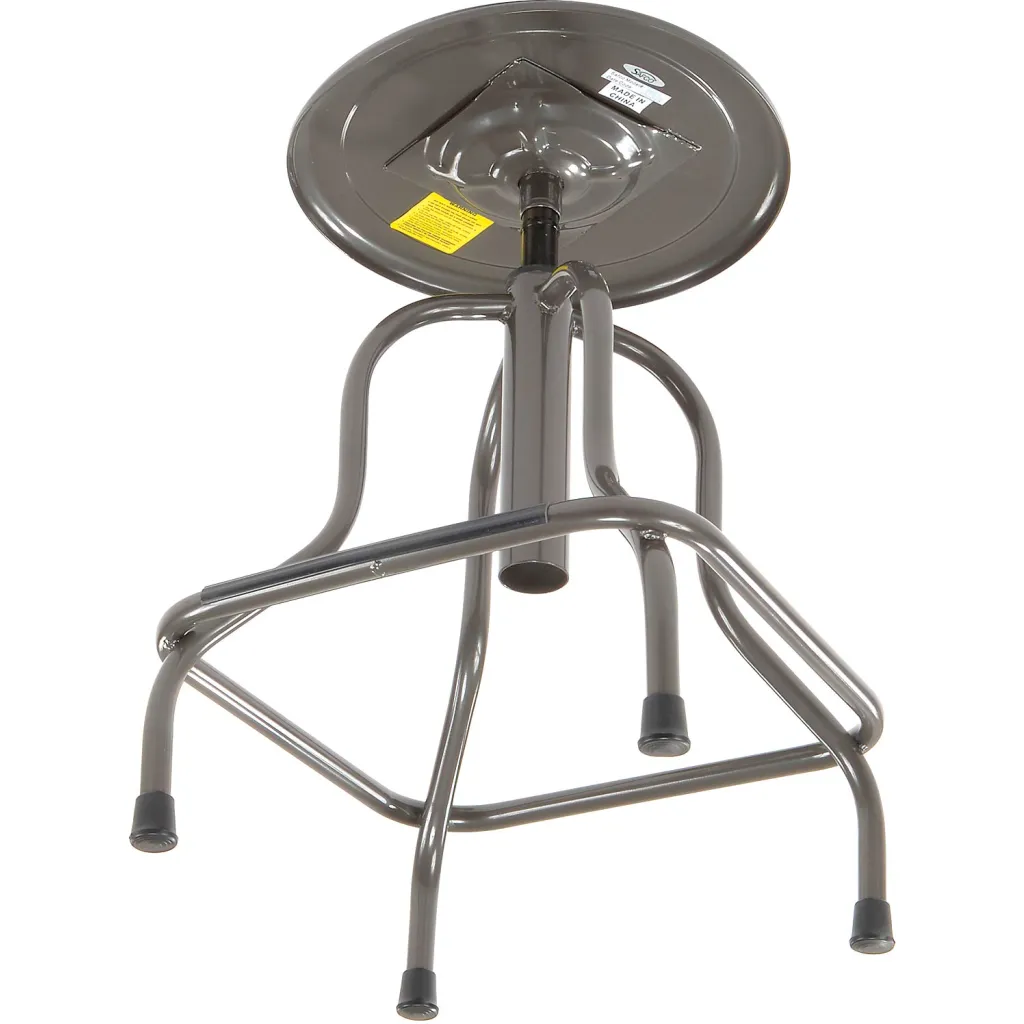 A gray metal stool with a round seat and four legs, viewed from below.
