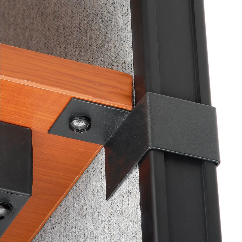 A close-up of a black metal bracket and screw attached to a wooden shelf.