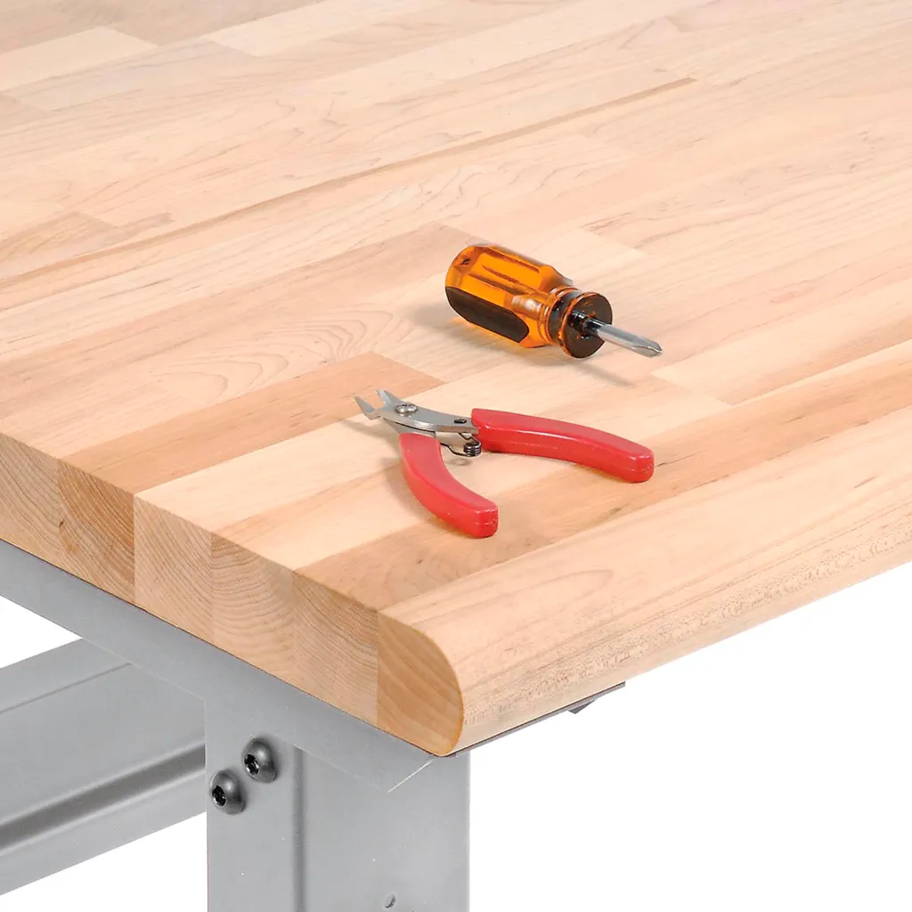 Close-up of wooden workbench top with tools
