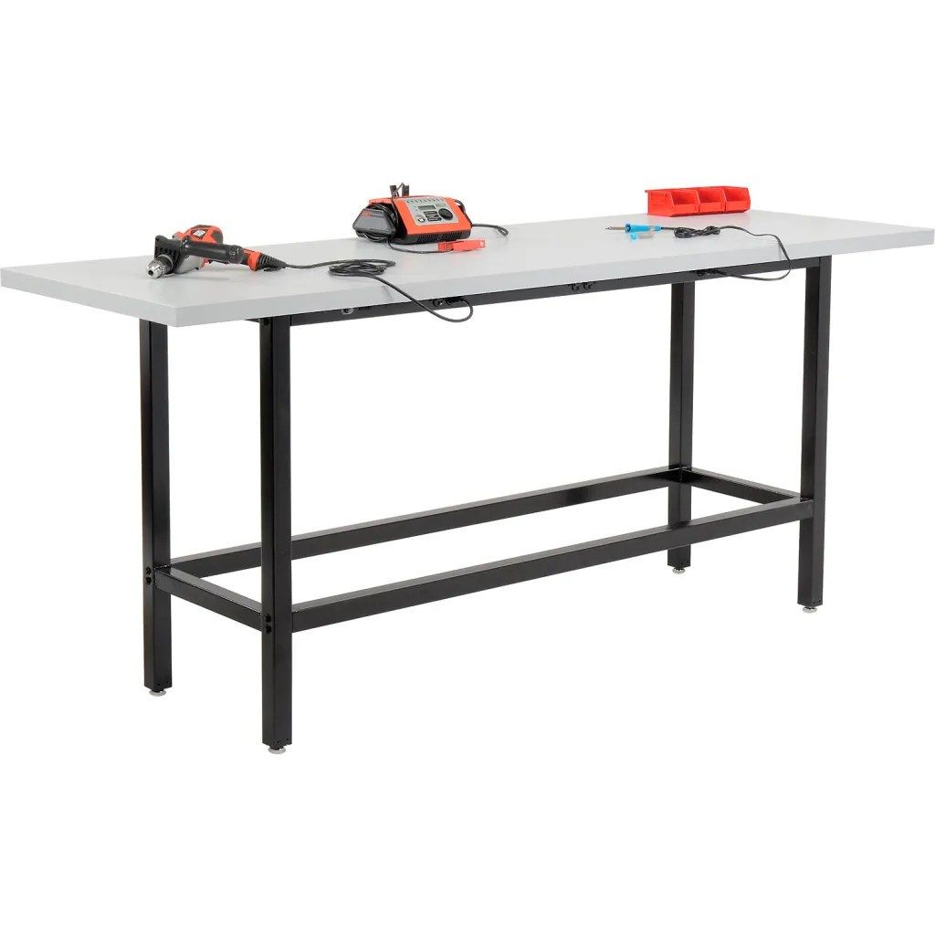 A workbench with various tools and equipment, including a heat gun, a radio, and a toolbox.