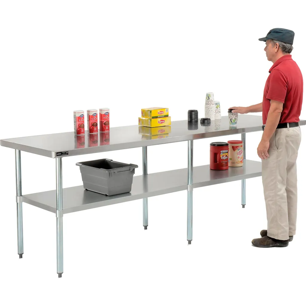 Stainless steel table with a single shelf and a man standing next to it
