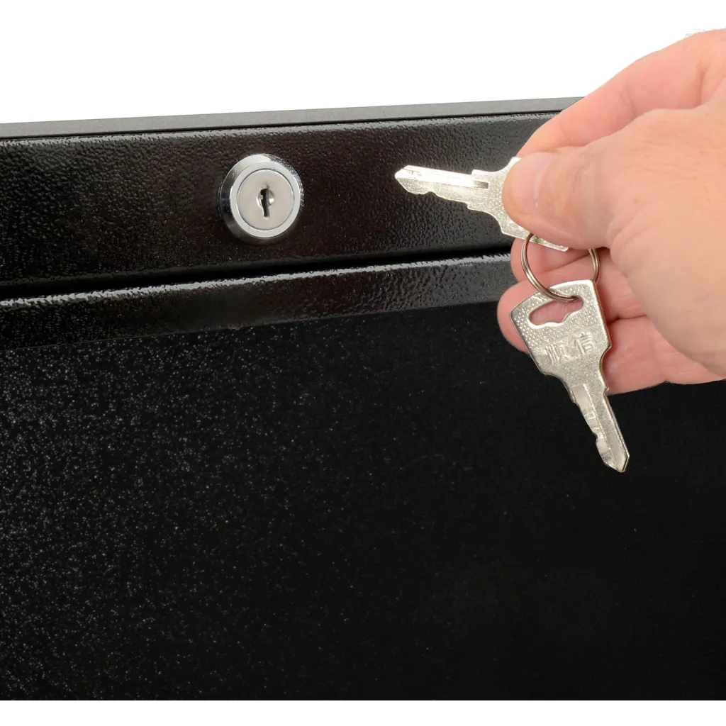 A hand holding keys inserting a key into a keyhole.