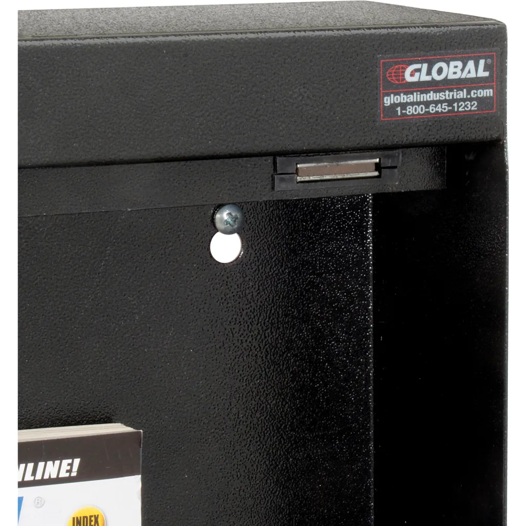A close-up of a black metal box with a label and a slot.