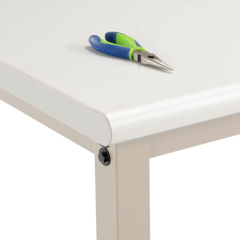 A close-up of a workbench with a tool on top