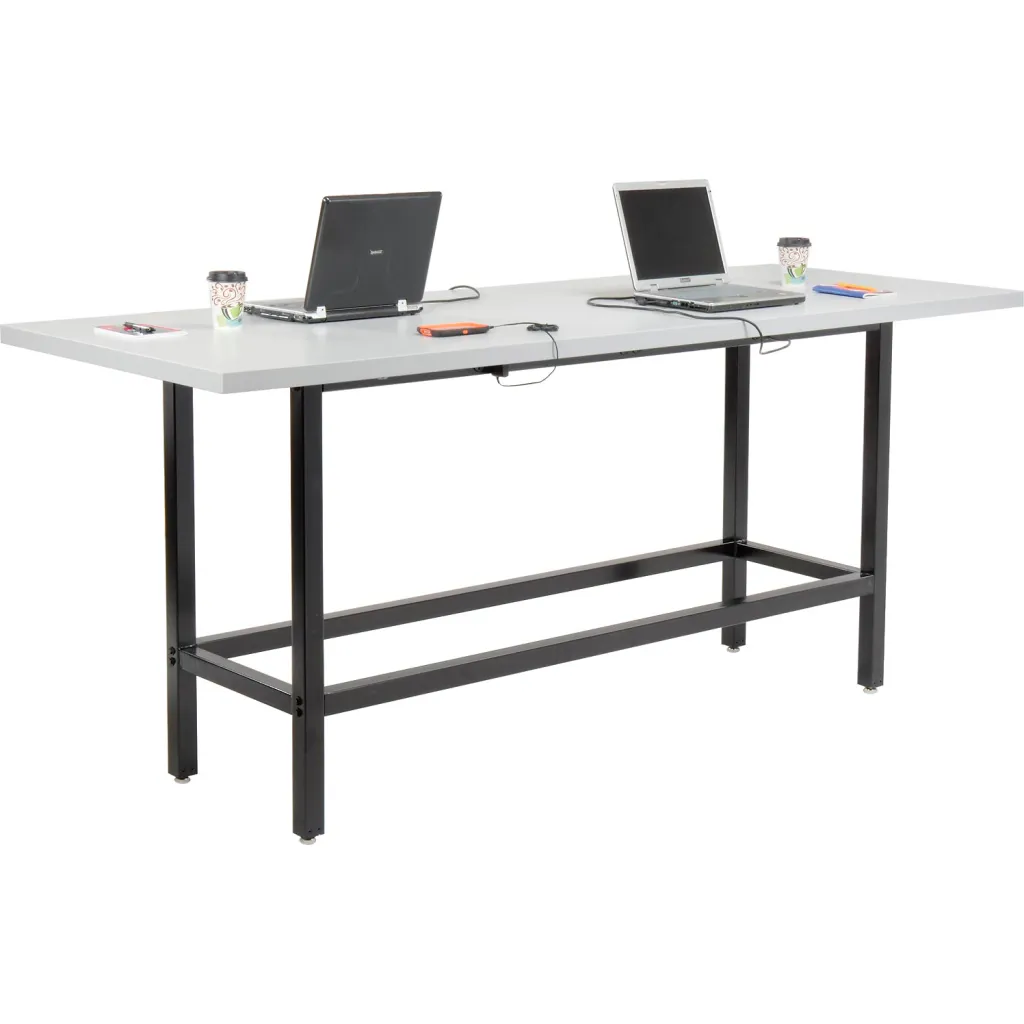 Standing desk with gray top and black frame, two laptops, and two stools