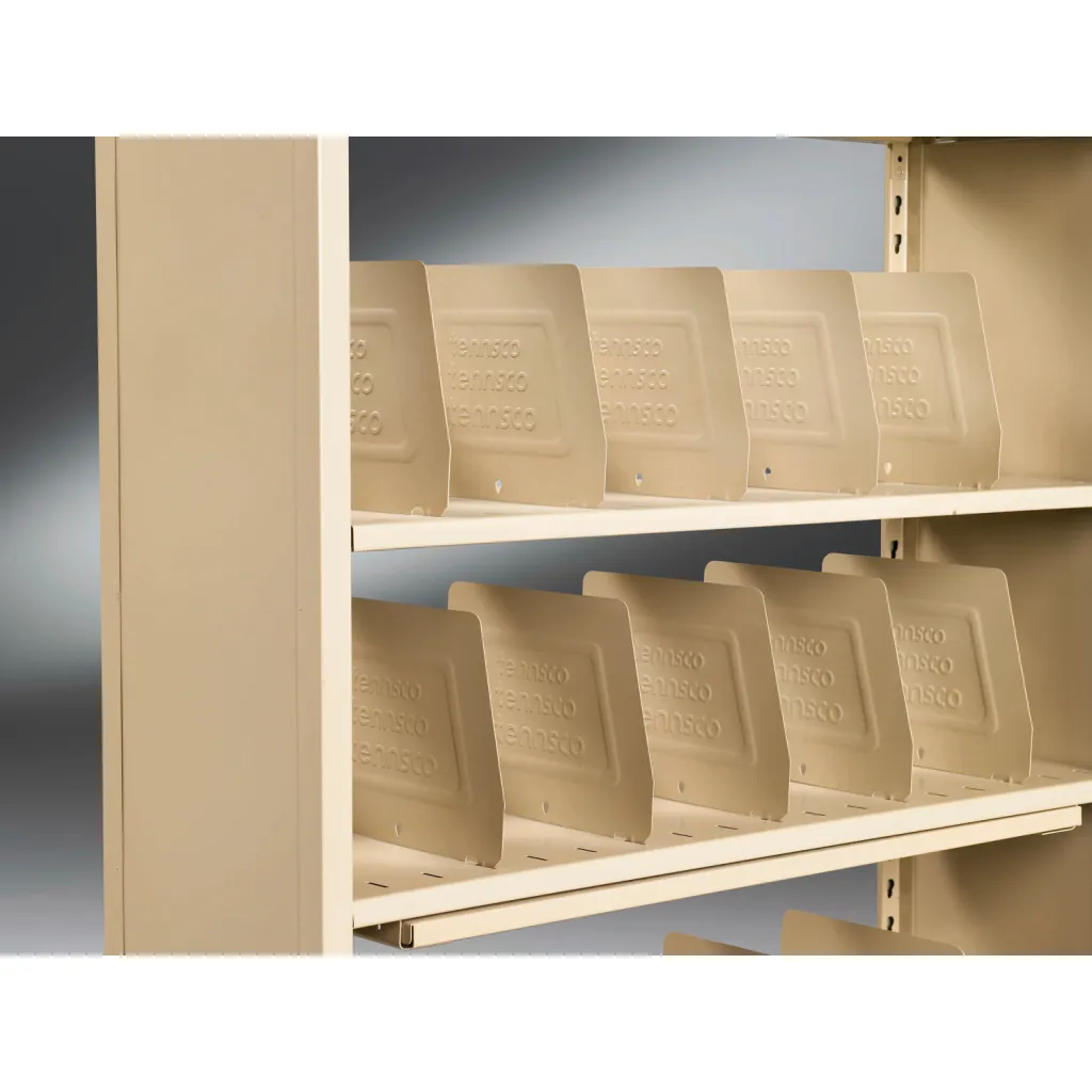 A close-up of empty beige file dividers on a shelving unit.