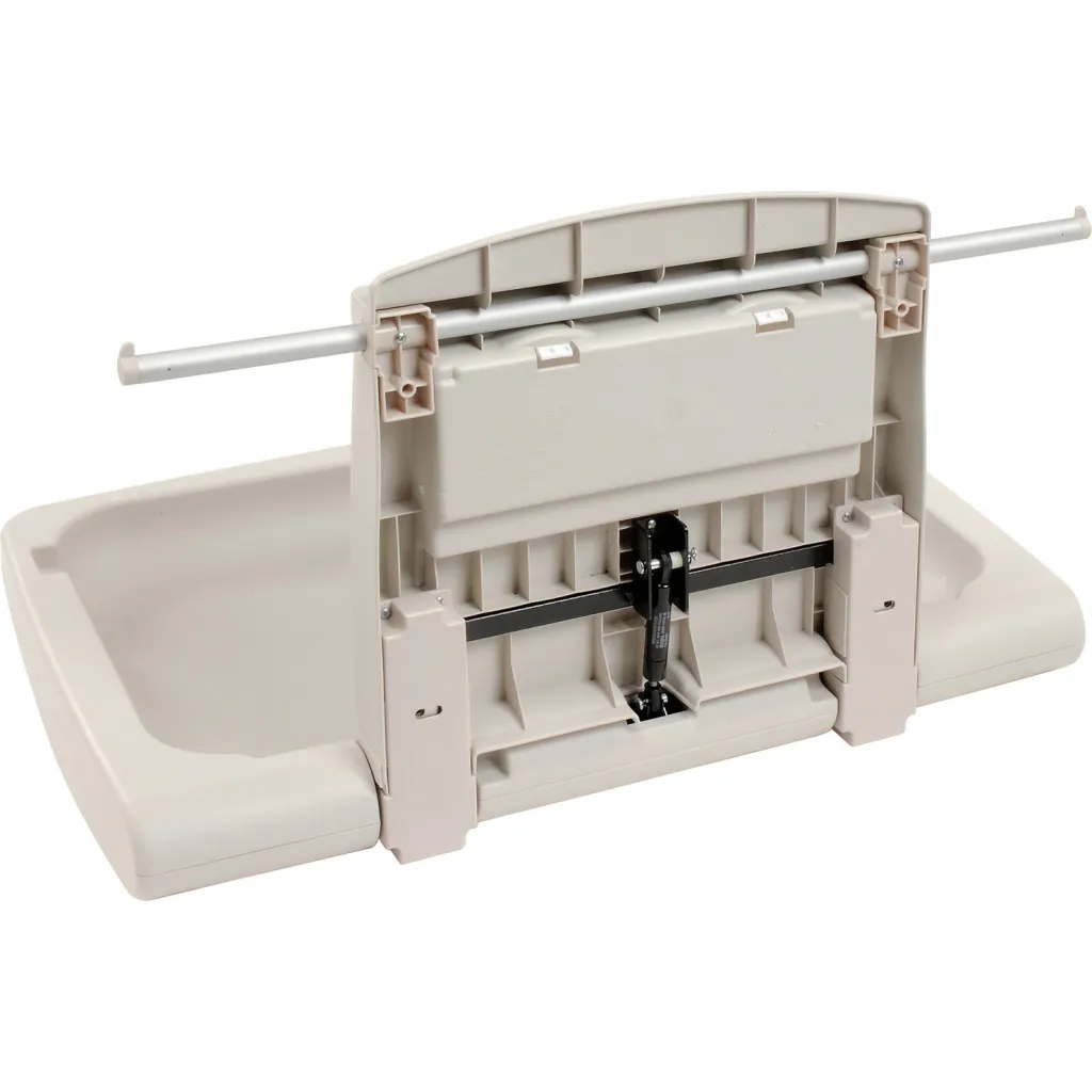 A beige plastic changing pad with a tray and metal rods