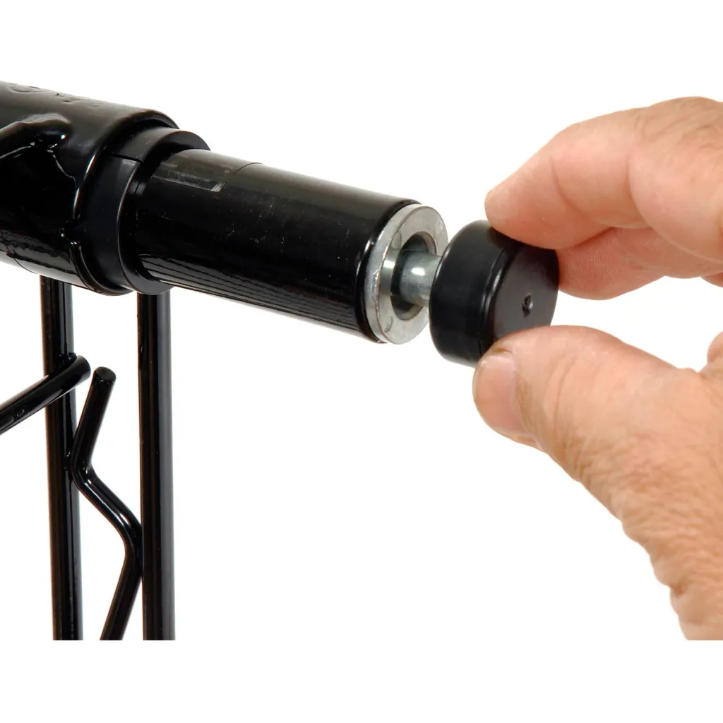 Hand adjusting black metal shelving foot