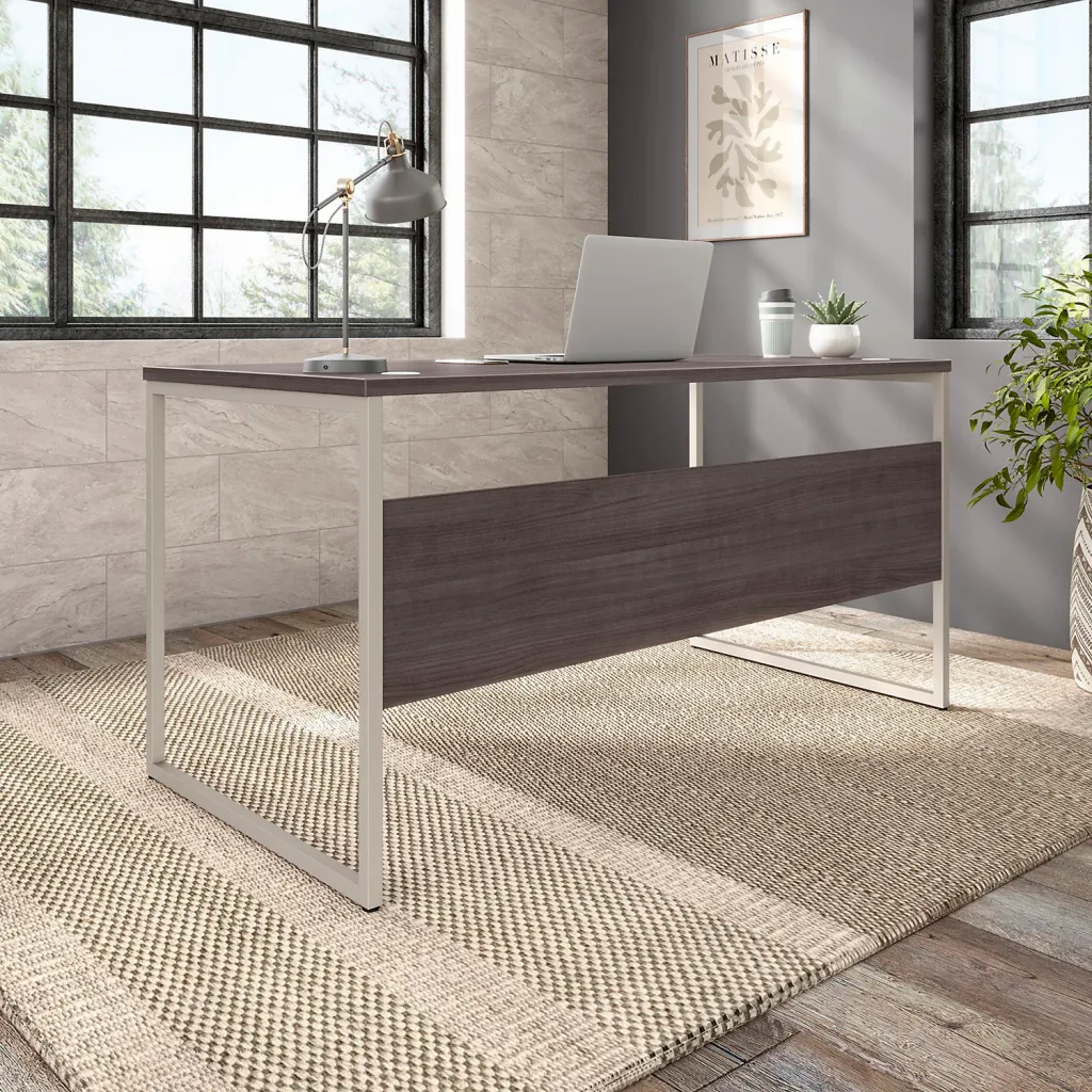 Brown desk with metal legs in office setting from different angle