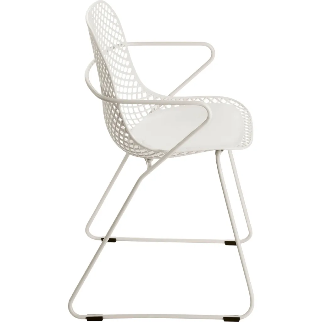 White chair with mesh back and armrests from side view