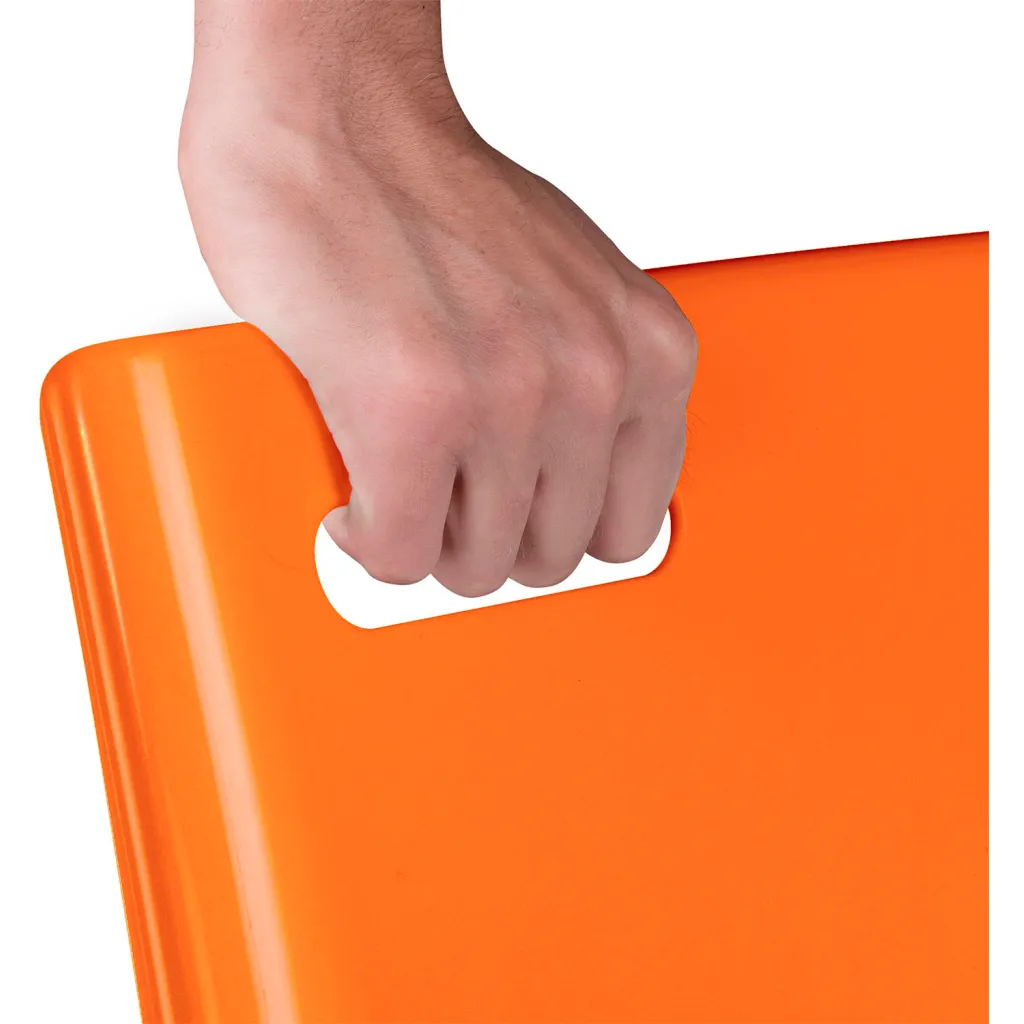 Hand holding handle of orange plastic chair