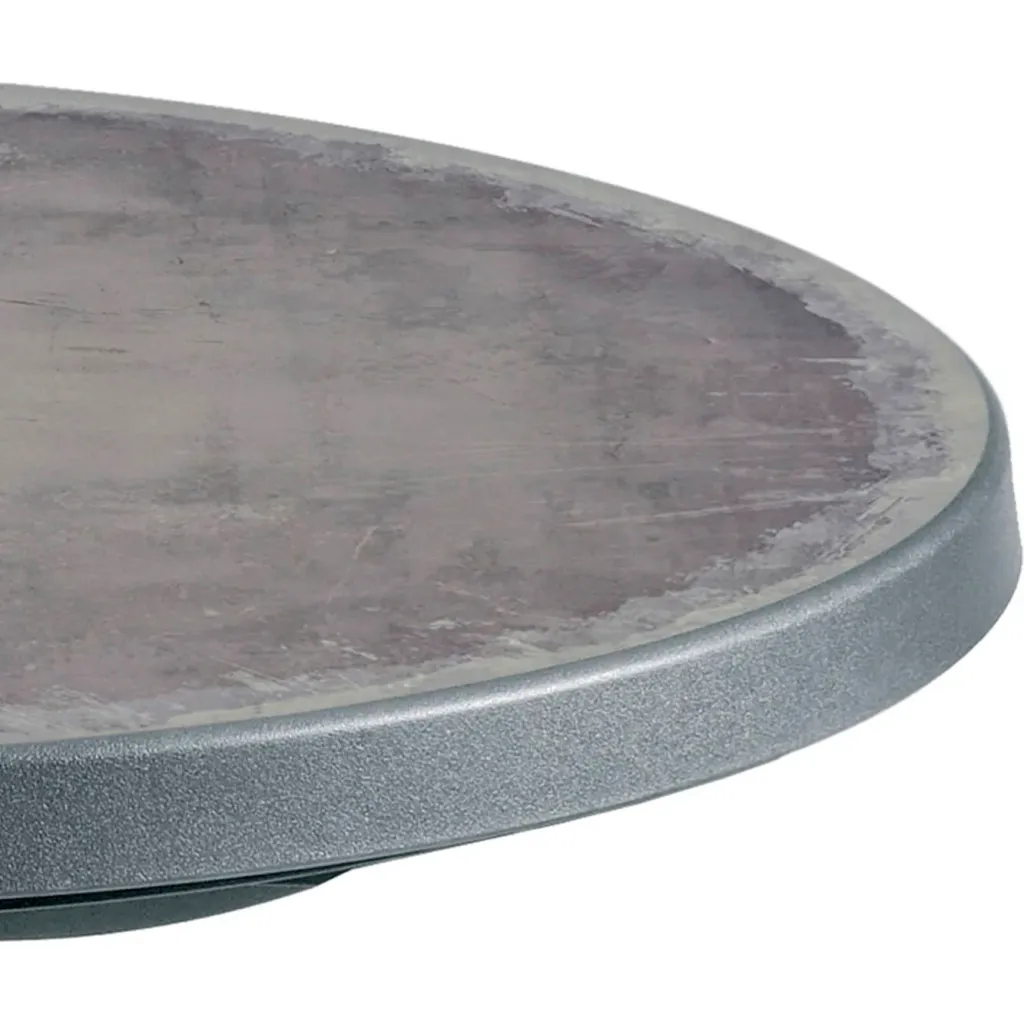 Close-up of round gray patio table edge