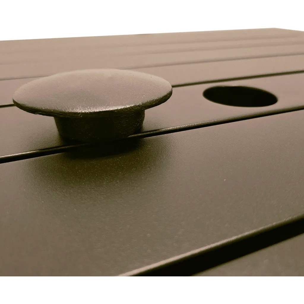 Close-up of knob and hole on brown outdoor table