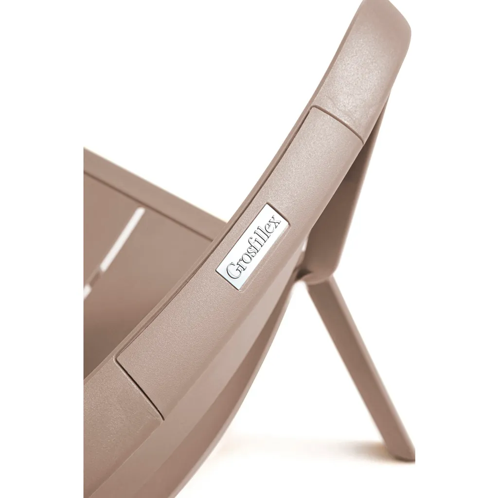 Close-up of chair frame with 'Grosfillex' label