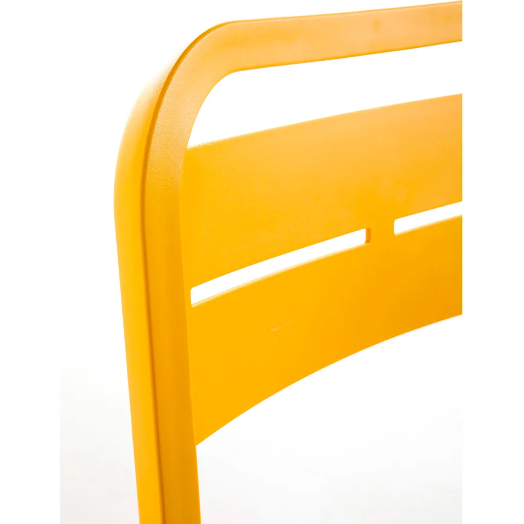 Close-up of yellow chair backrest
