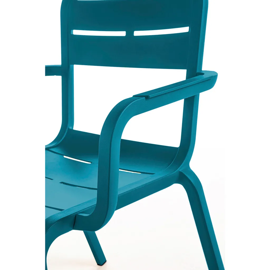 Close-up of teal chair with armrests and a backrest