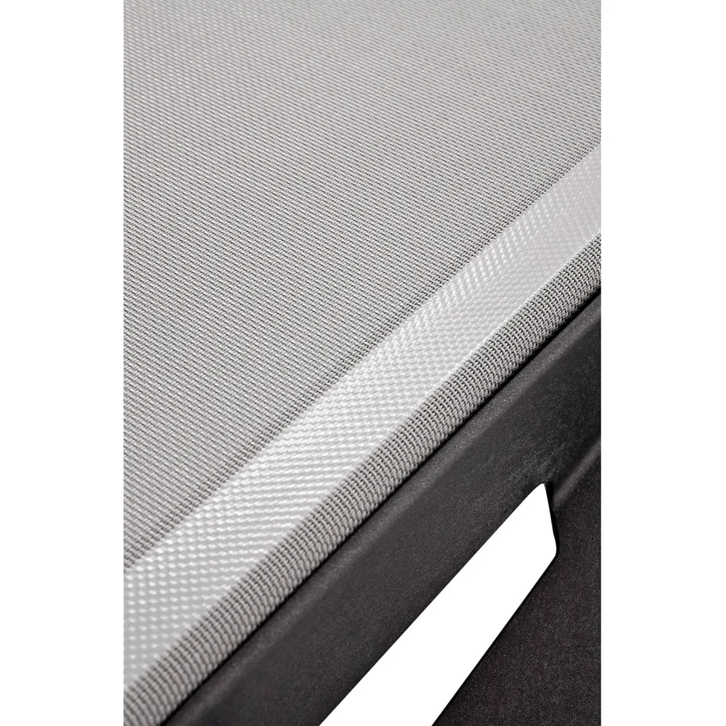 Close-up of gray fabric and black frame of outdoor chaise lounge chair