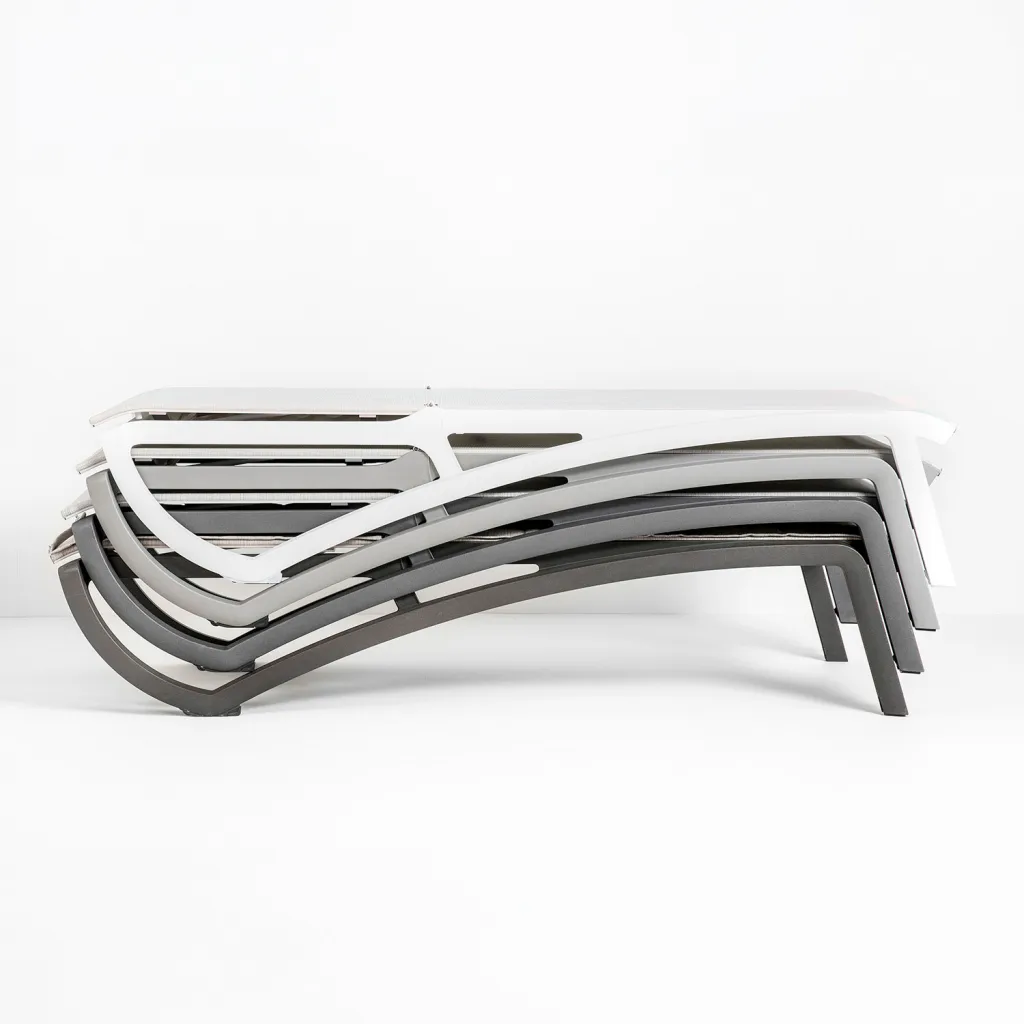 Stack of chaise lounge chairs in various colors