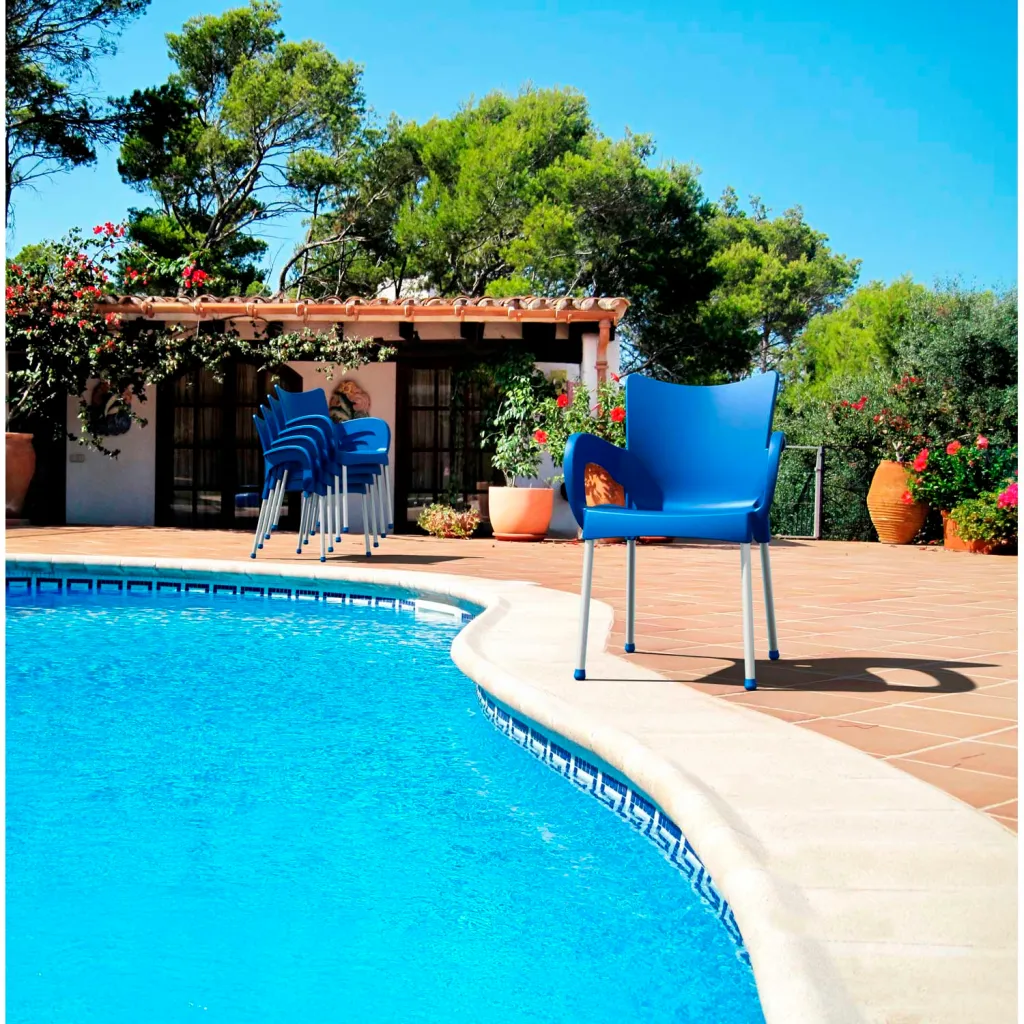 Blue chair by pool with other chairs in background