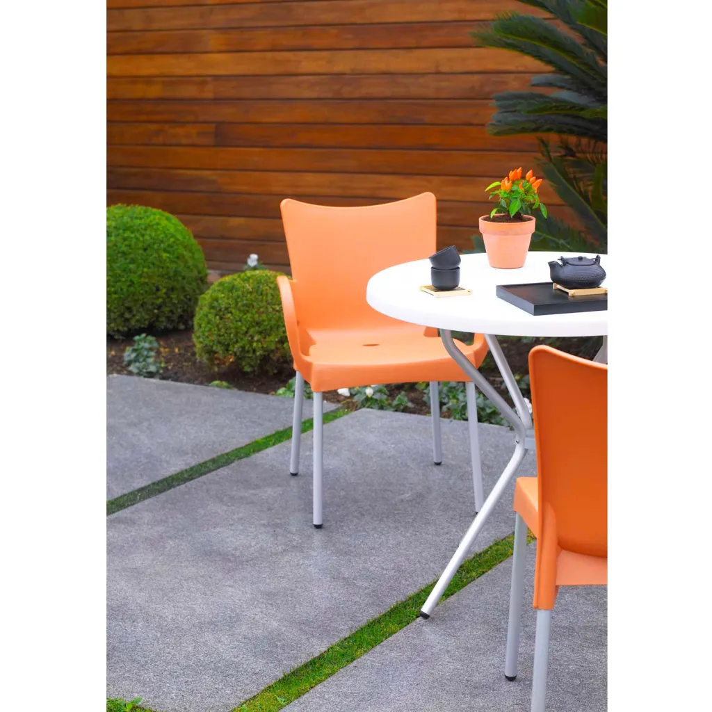 Orange chairs and table in outdoor setting