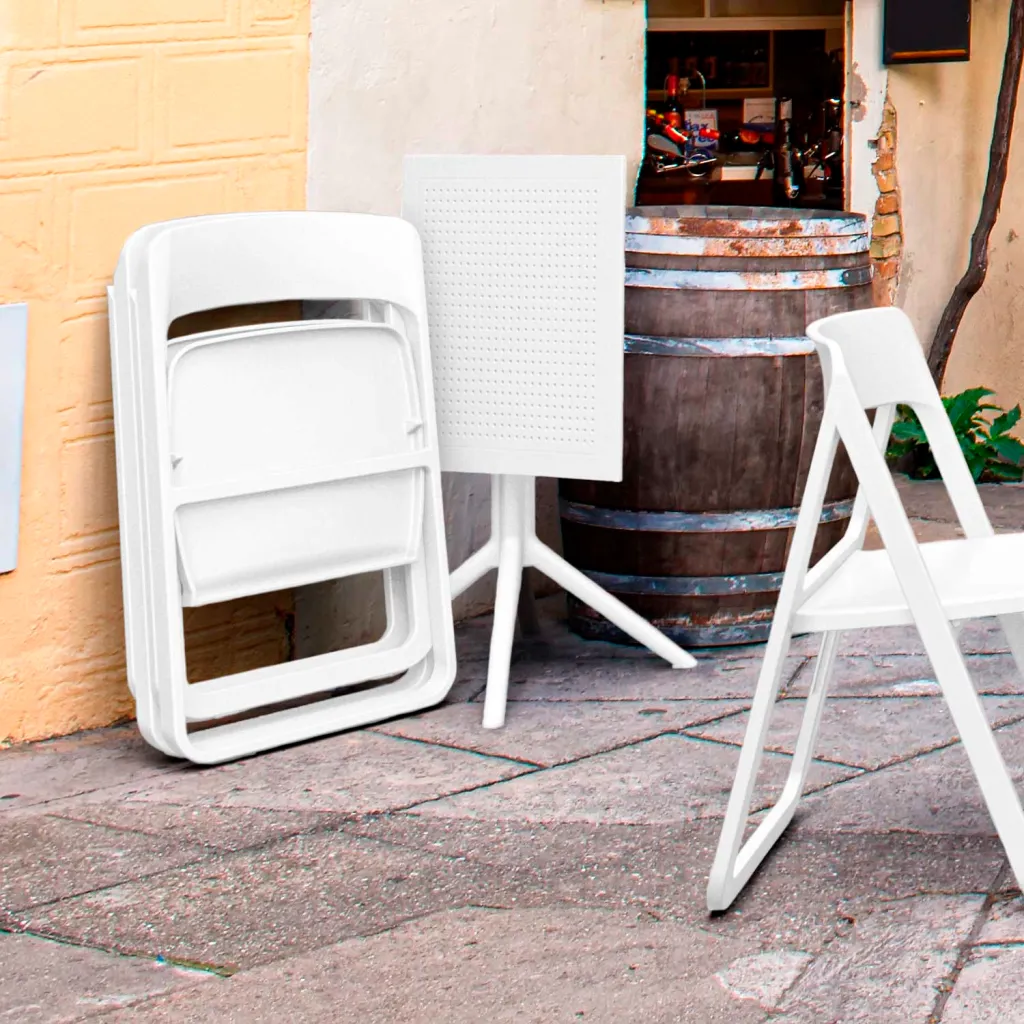 Stacked white chairs and single chair