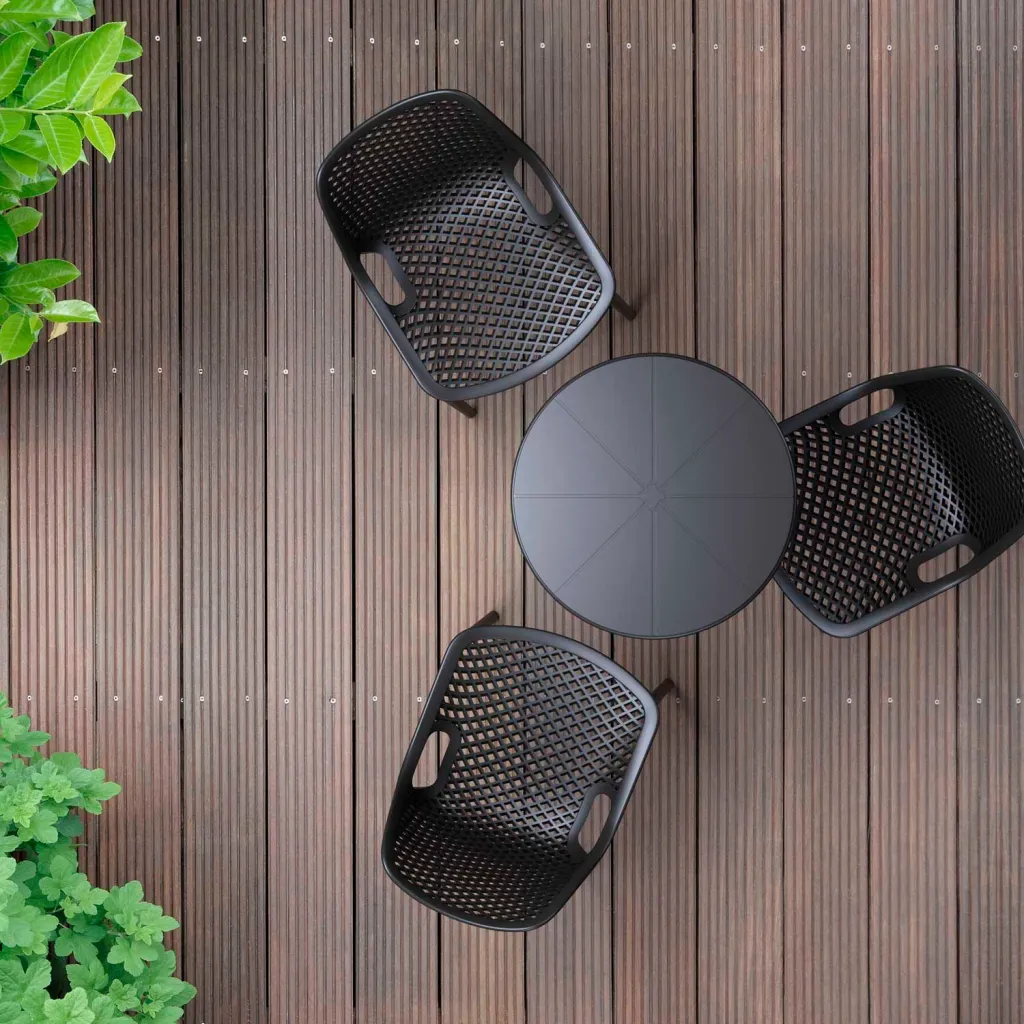 Black round outdoor table with three chairs