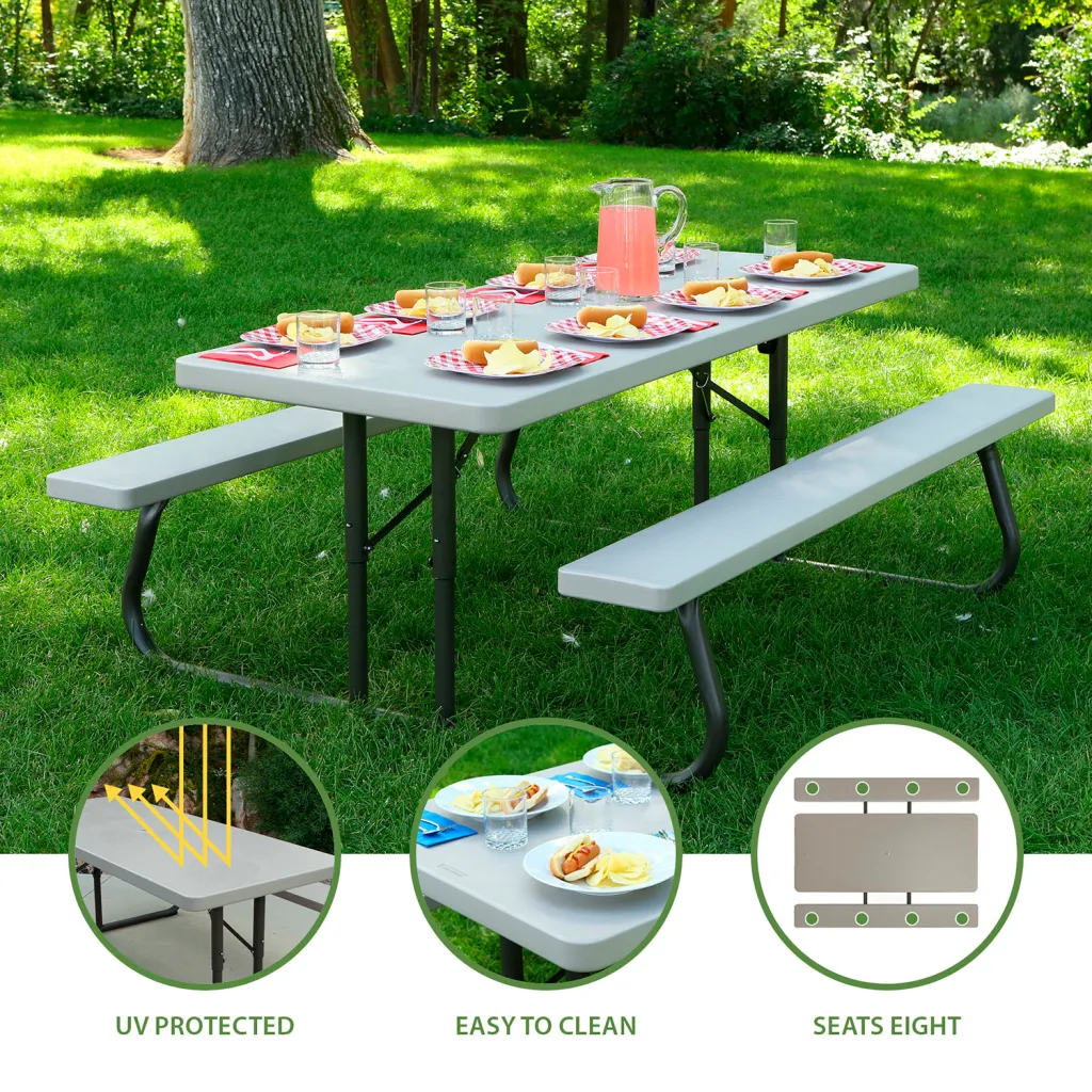 A picnic table with benches set up in a park