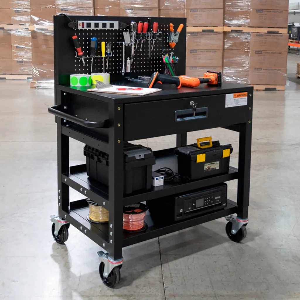 Black metal tool cart with tools and equipment on shelves and pegboard