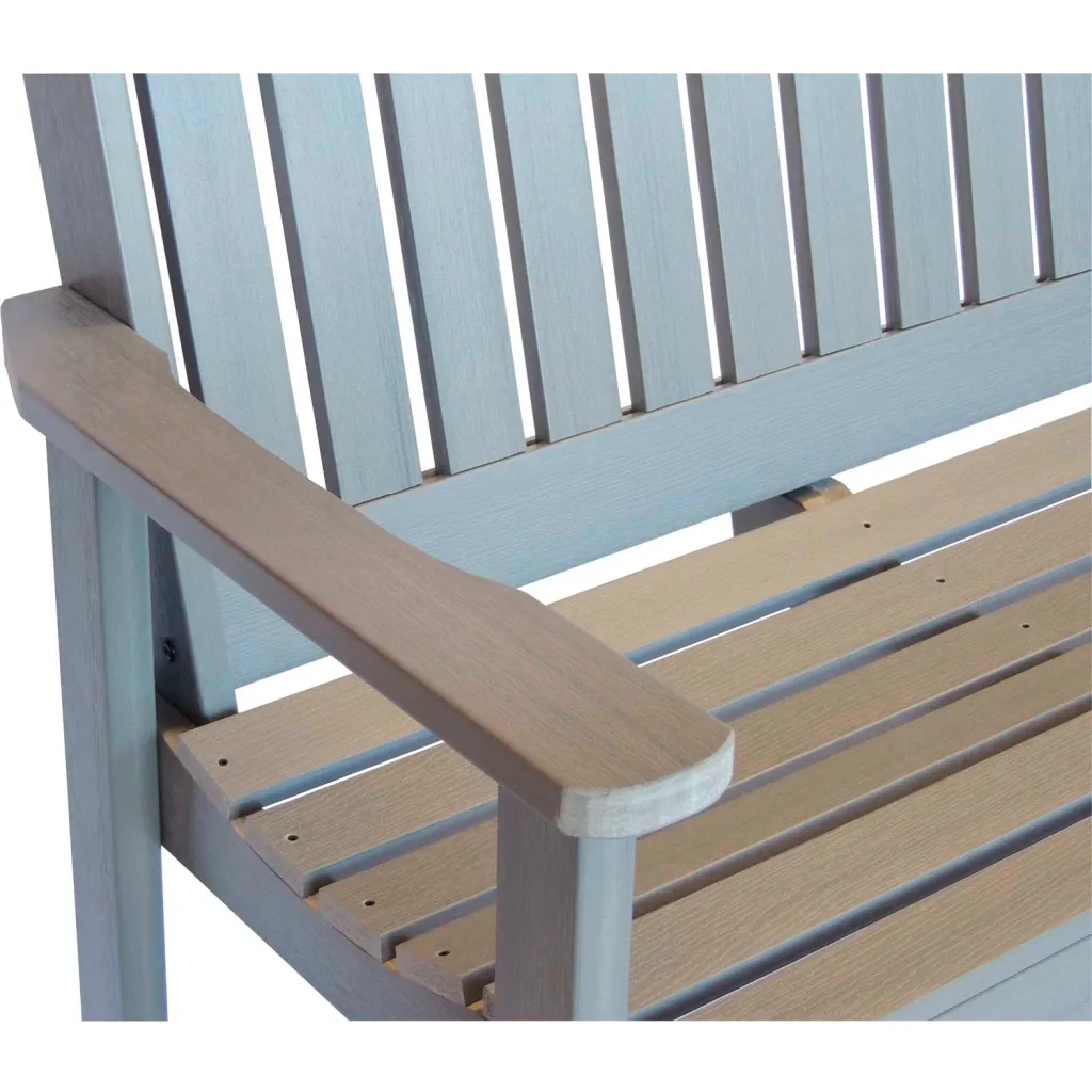A close-up of the armrest and seat of a gray wooden bench.