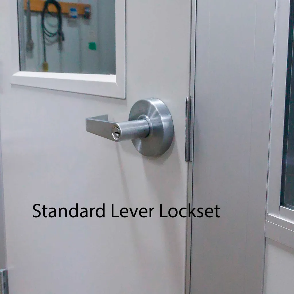Close-up of a standard lever lockset mounted on a metal door of the modular enclosure.