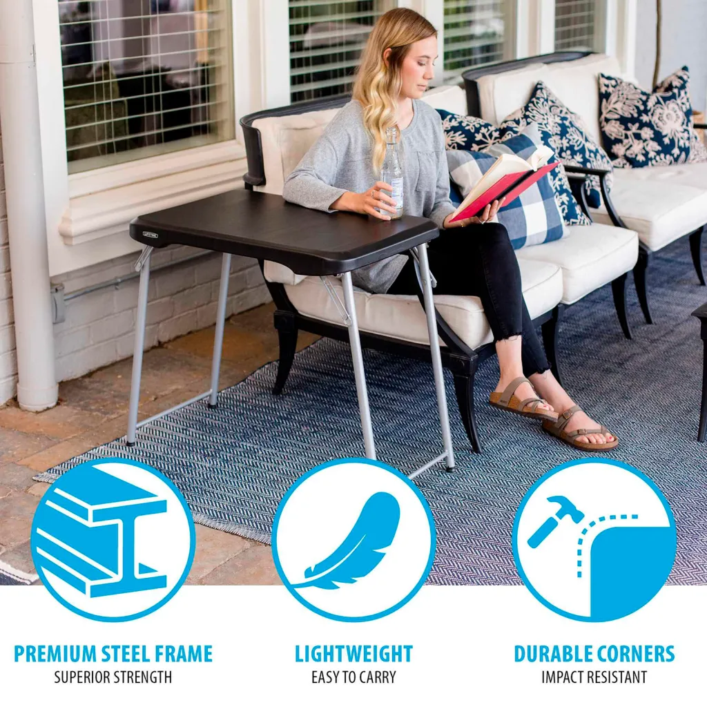 Woman using black folding table on a patio