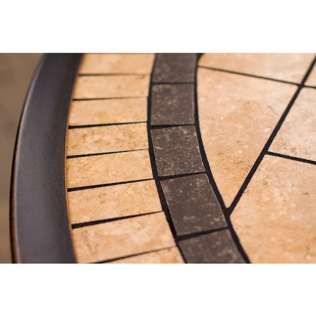 Close-up of a tile table top with a decorative border.