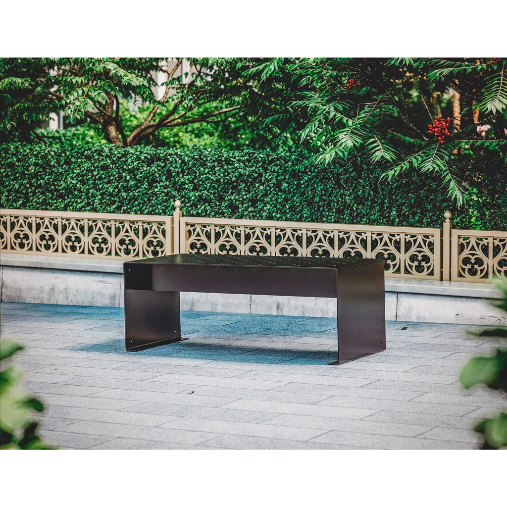 Black metal bench with perforated top