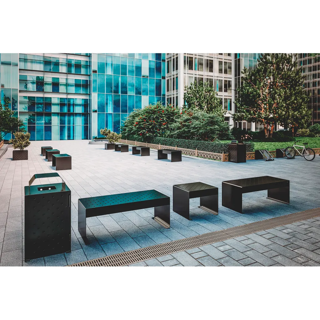 Multiple black metal benches in public space