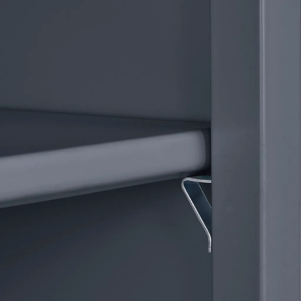 Close-up of gray metal storage cabinet shelf and door frame