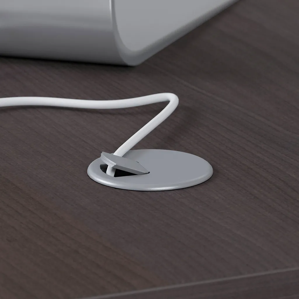 A close-up of a cable management system on a desk