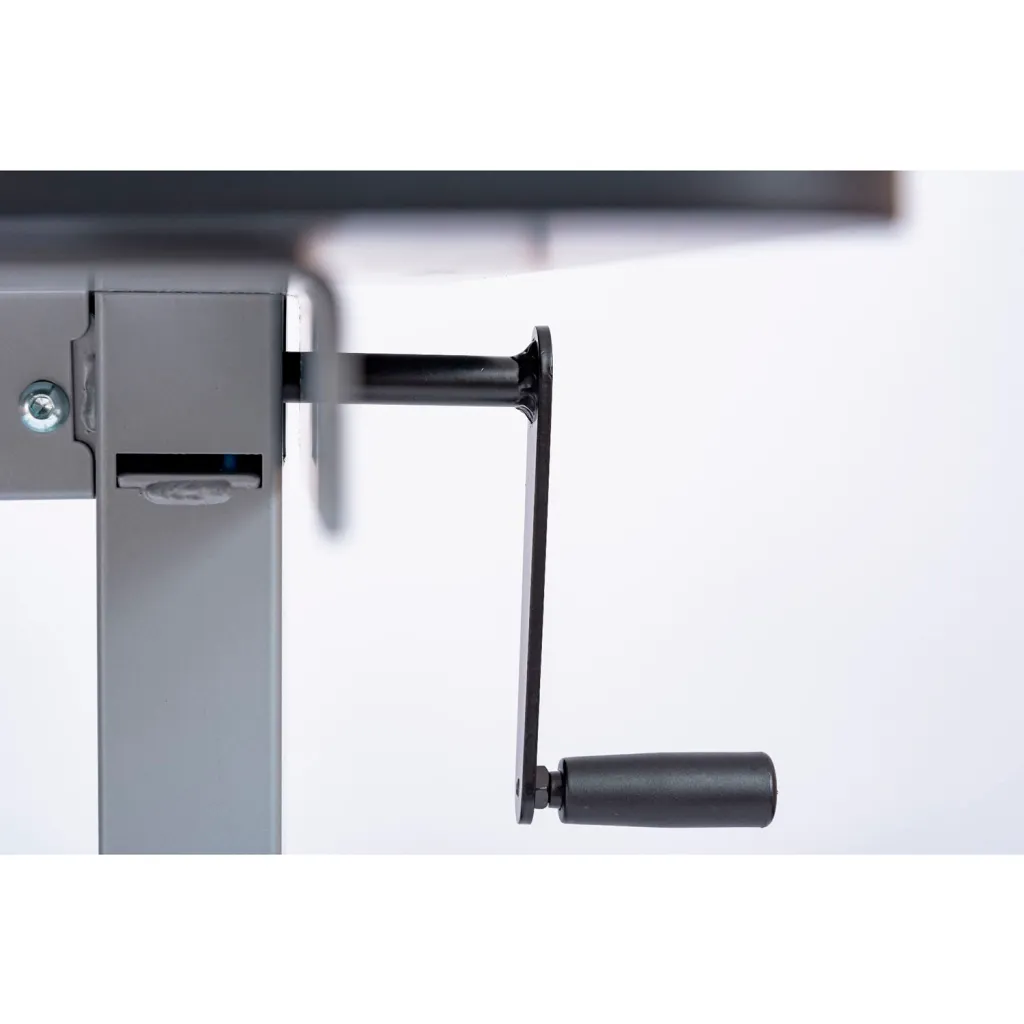 A close-up of the crank handle on the table.