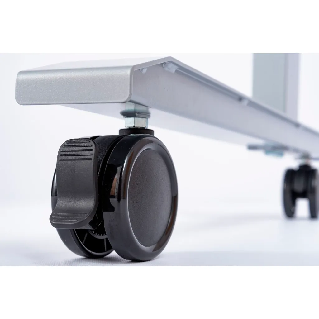 A close-up of the black plastic caster wheel on the table leg.